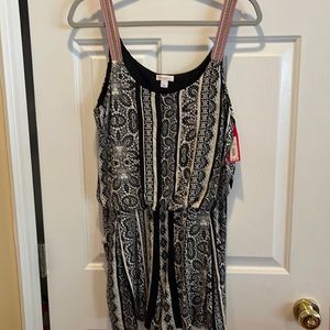 Brand new black white patterned shorts romper.  Size L